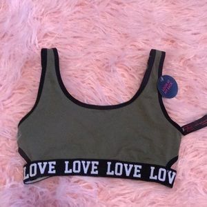NWT - sports bra with side cutouts. Size 32.